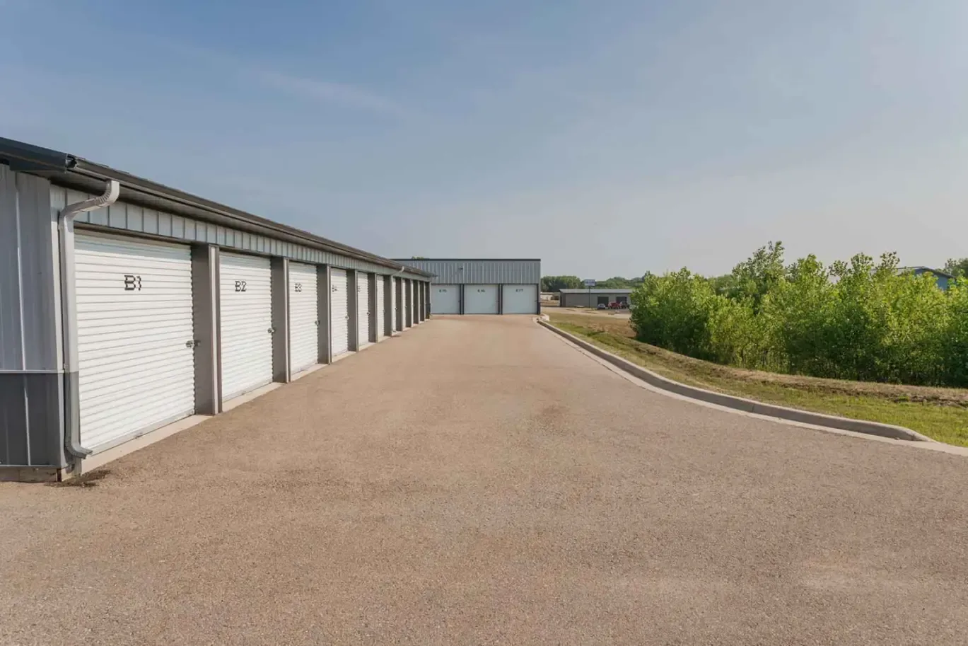 A row of storage units at the property edge.