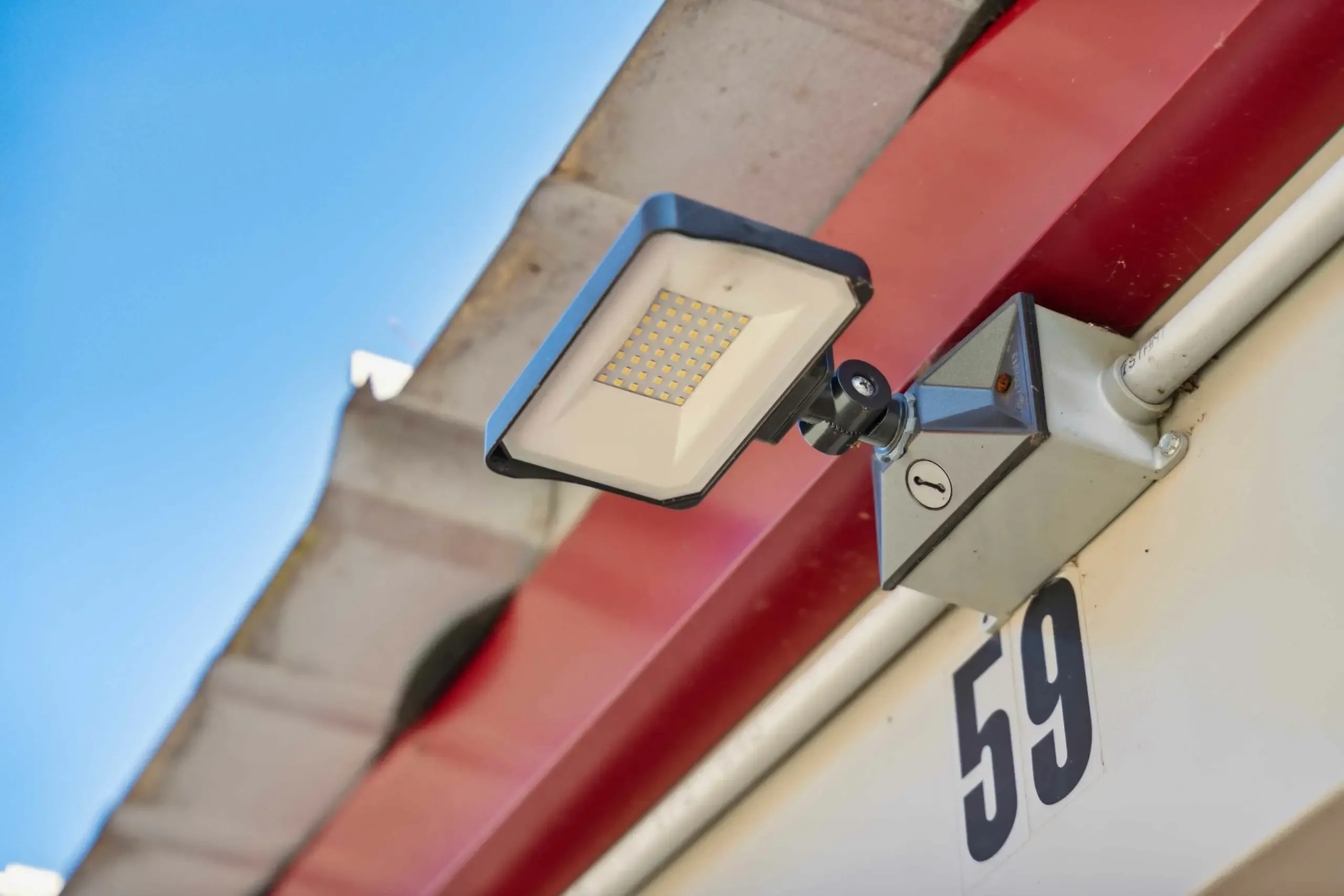 A floodlight in front of a storage unit.