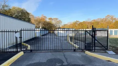 Self storage facility exterior with secure fencing and gated entry