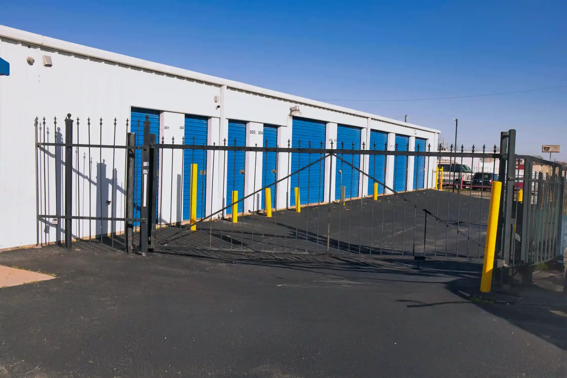facility gate in front of storage units