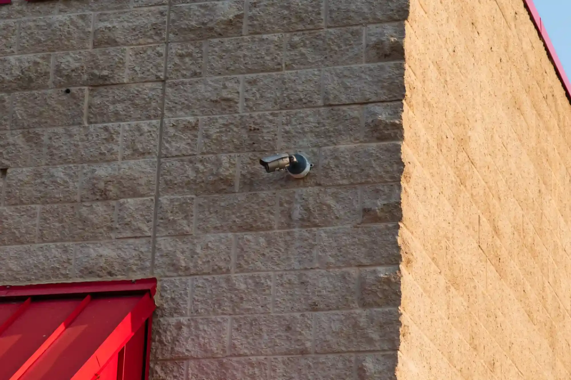 A security camera on the building exterior.